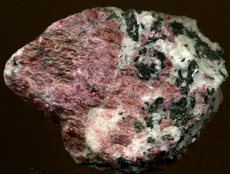 Pink eudialyte rare-earth ore in a crystalline specimen