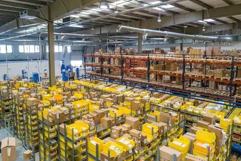 Warehouse aisle with palletised cargo ready for dispatch
